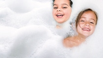 Children bathing with foam