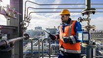 A production worker checking a BASF plant during a control round.