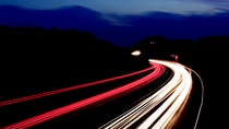 long exposed image of highway at night with red and yellow lines  long exposed image of highway at night with red and yellow lines