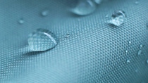 Water drops on waterproof nylon fabric. Water drops on waterproof nylon fabric.