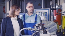 Two BASF scientists working in a test facility