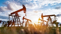 Oil pumps in a field. Oil pumps in a field.