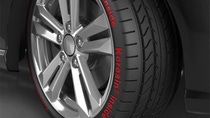 Close up of tire with silver rims with words "Koresin inside"