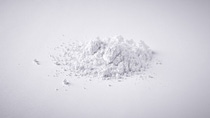 Heap of calcium carbonate powder on white background Heap of calcium carbonate powder on white background
