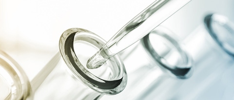 A pipette and four test tubes. A pipette and four test tubes.