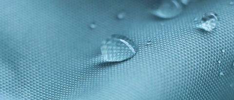 Water drops on waterproof nylon fabric. Water drops on waterproof nylon fabric.