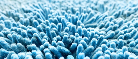 Hiker with arms spread wide on a mountain top Hiker with arms spread wide on a mountain top