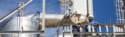 Production Manager Mark Hughes (right) and Shift Supervisor Kenny Calvaruso Jr. (left) stand at the bottom of the methylamines towers during a safety walkthrough. As the newest unit at BASF Verbund site in Geismar, Louisiana, methylamines started production in 2012. Methylamine is used in the production of agrochemicals, personal care products, detergents, pharmaceuticals, textiles, solvents and animal feed additives.